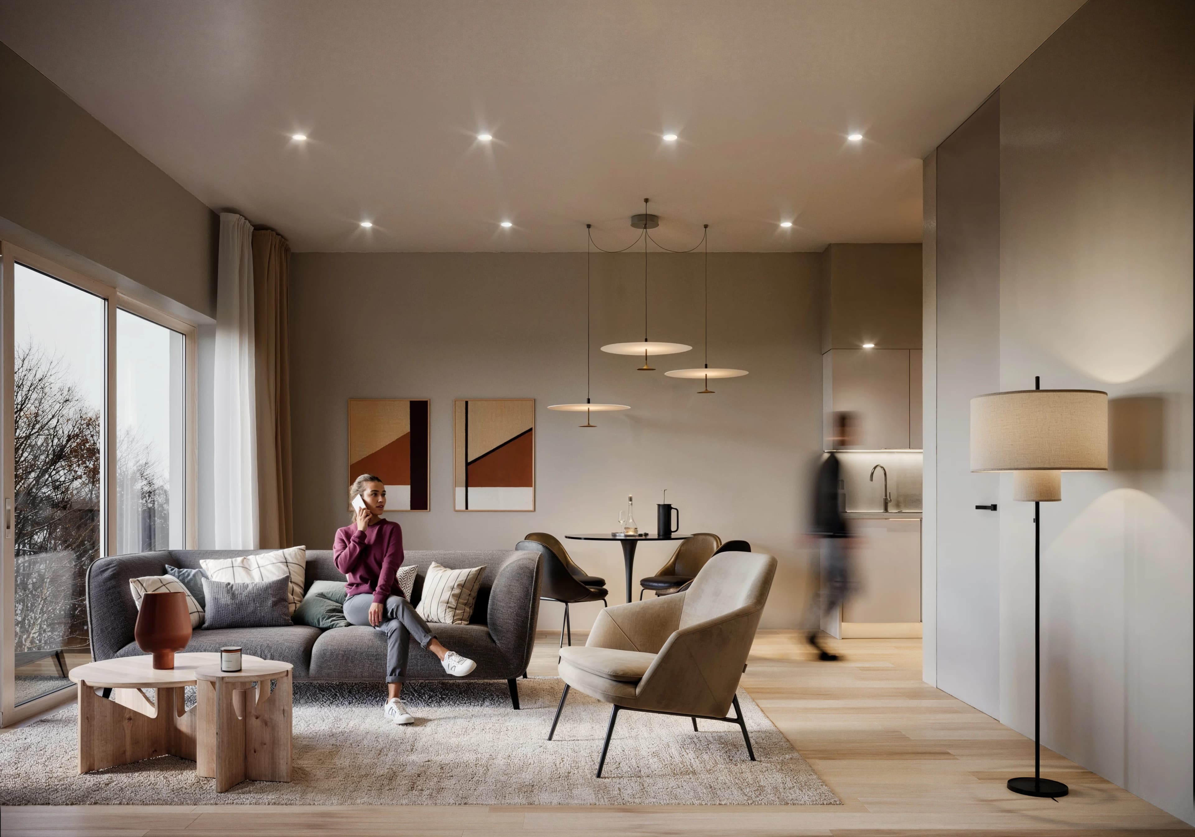 Living area with full-height glazing opening onto the garden